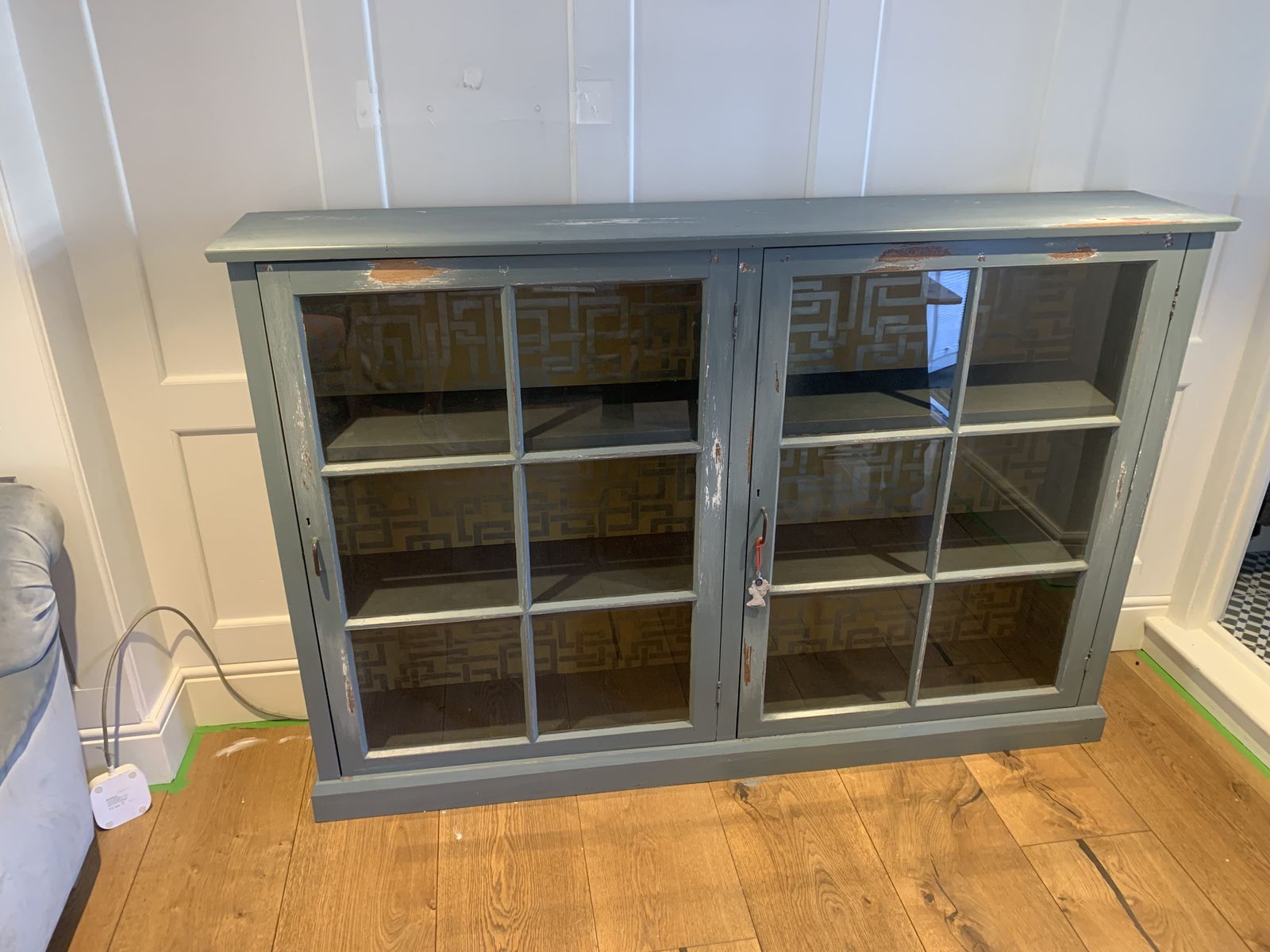 Vintage Wooden Display Cabinet Painted In A Distressed Look Using Farrow And Ball Incyra Blue. Decorative Farrow And Ball Paper To The Rear Internal Walls Using Double Sided Tape Which Can Easily Be Removed