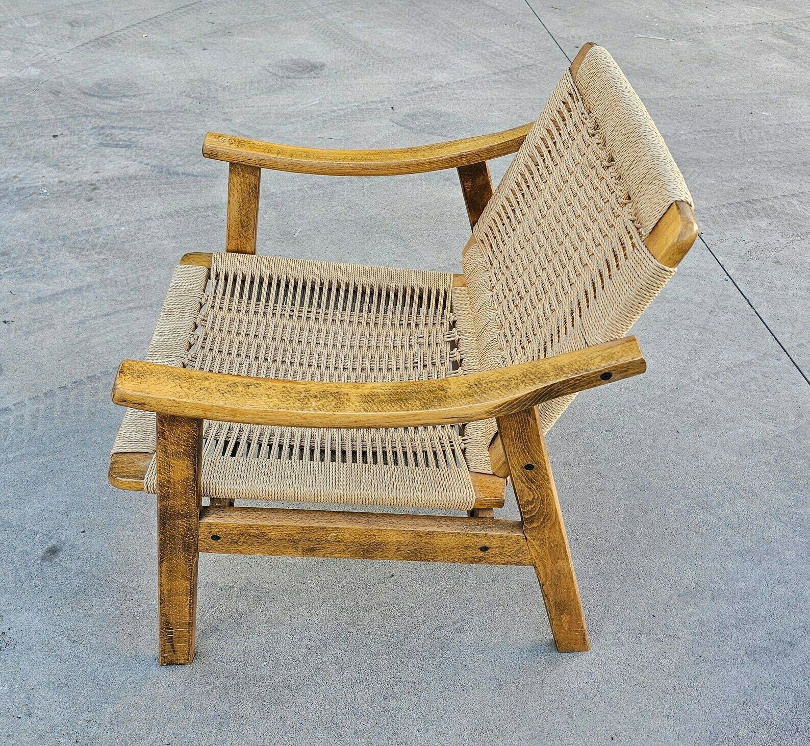Pair Of Mid Century Modern Armchairs With Ottomans Done In Oak And Danish Paper Cord Done In Hans J. Wegner Style / Made In Yugoslavia In 1960s photo vintage
