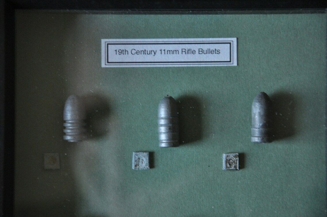 19th Century 11mm Rifle Cast Lead Bullets In Display Frame photo furniture