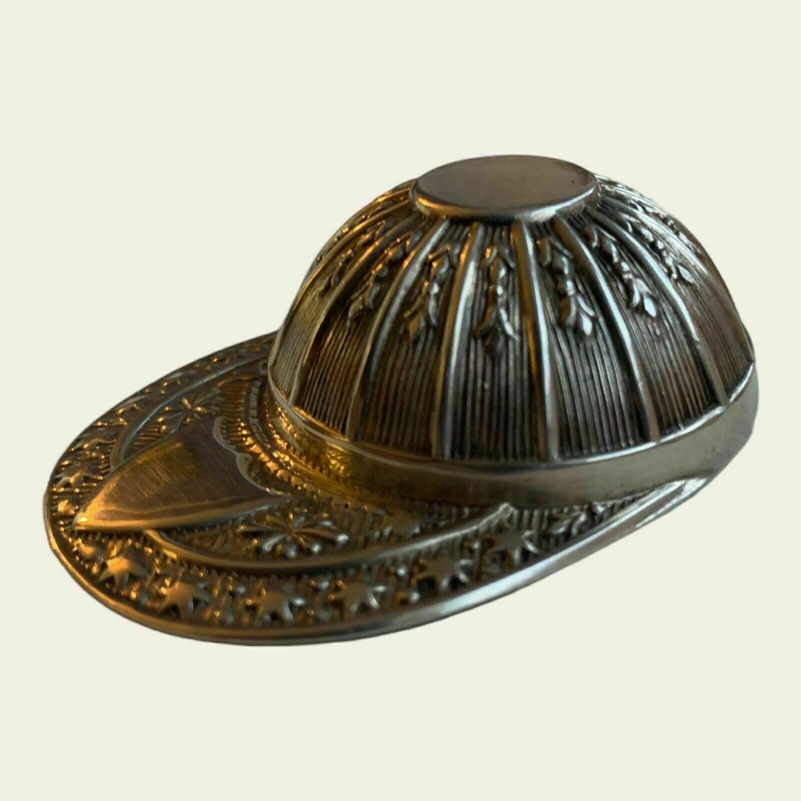 A Whimsical Sterling Silver Spoon Caddy In The Shape Of A Jockey's Cap photo furniture
