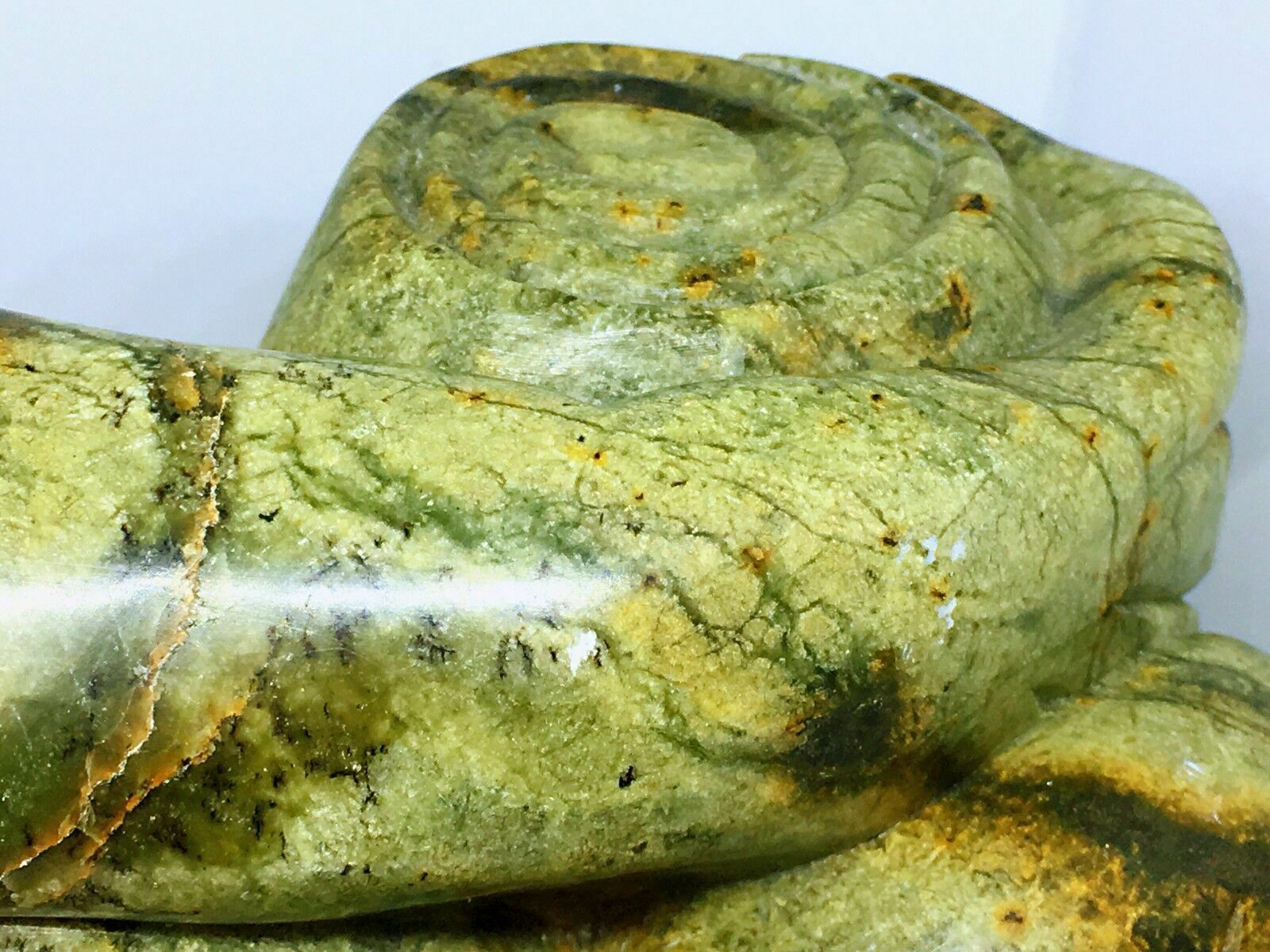 Jade(tough, Green Mineral Either Jadeite Or Nephrite Amphibole)frog With A Book photo vinterior