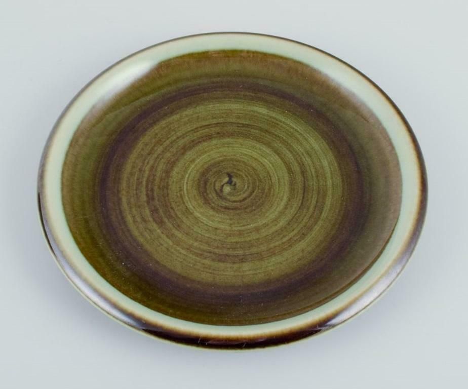 Marianne Westman For Rörstrand. "Maya", Set Of Ten Plates With Green Toned Glaze photo for sale