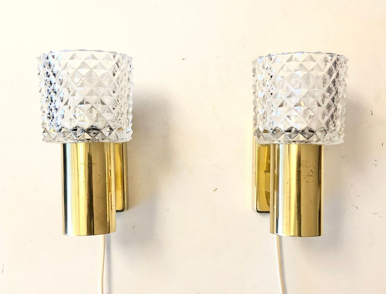 Pair Of Elegant Danish Mid Century Brass Wall Lamps In Modernist Design With Beautiful Crystal Shades photo for sale
