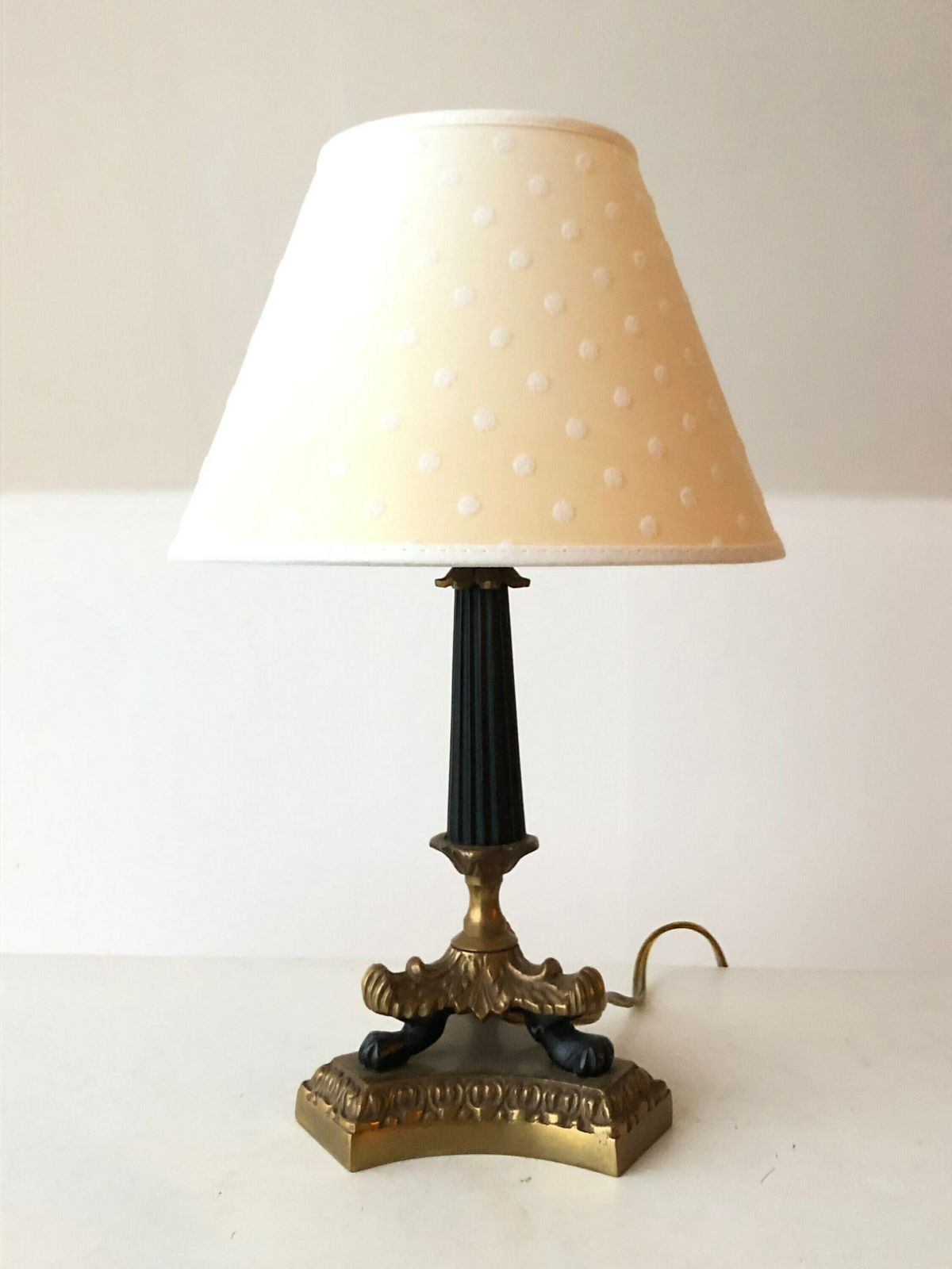 Empire Style Tripod Table Lamp In Brass And Black Painted Metal With Organic Shapes, Lion Feet And Off White Fabric Shade With Dots photo Lighting