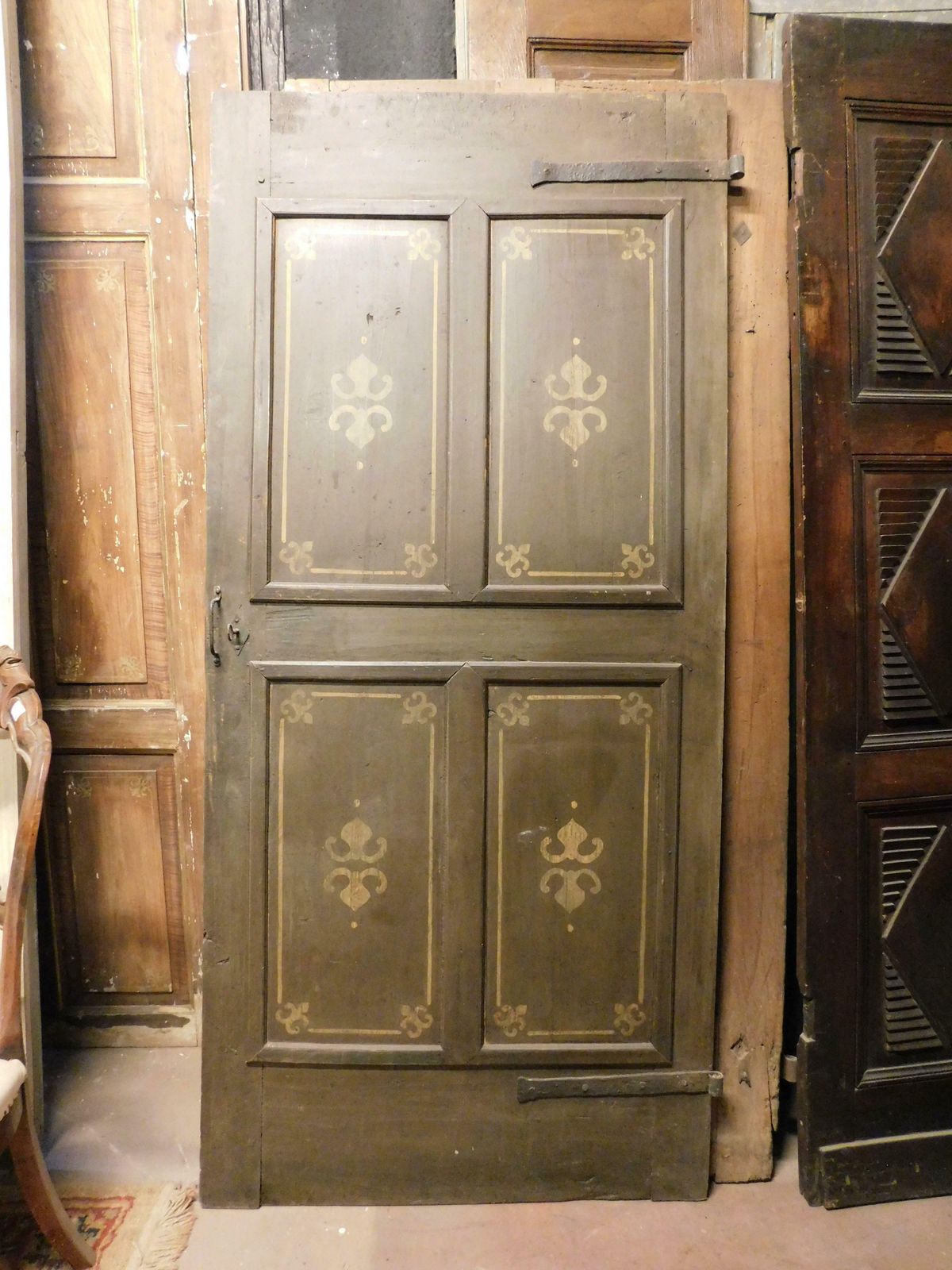 Old Door With 4 Painted Panels, Yellow Decorations On Green Background, Italy photo furniture