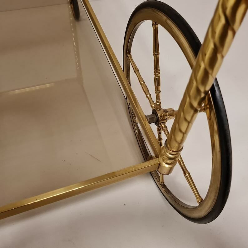 photo furniture Vintage Hollywood Regency Brass Trolley Bar Cart With Smoked Glass.