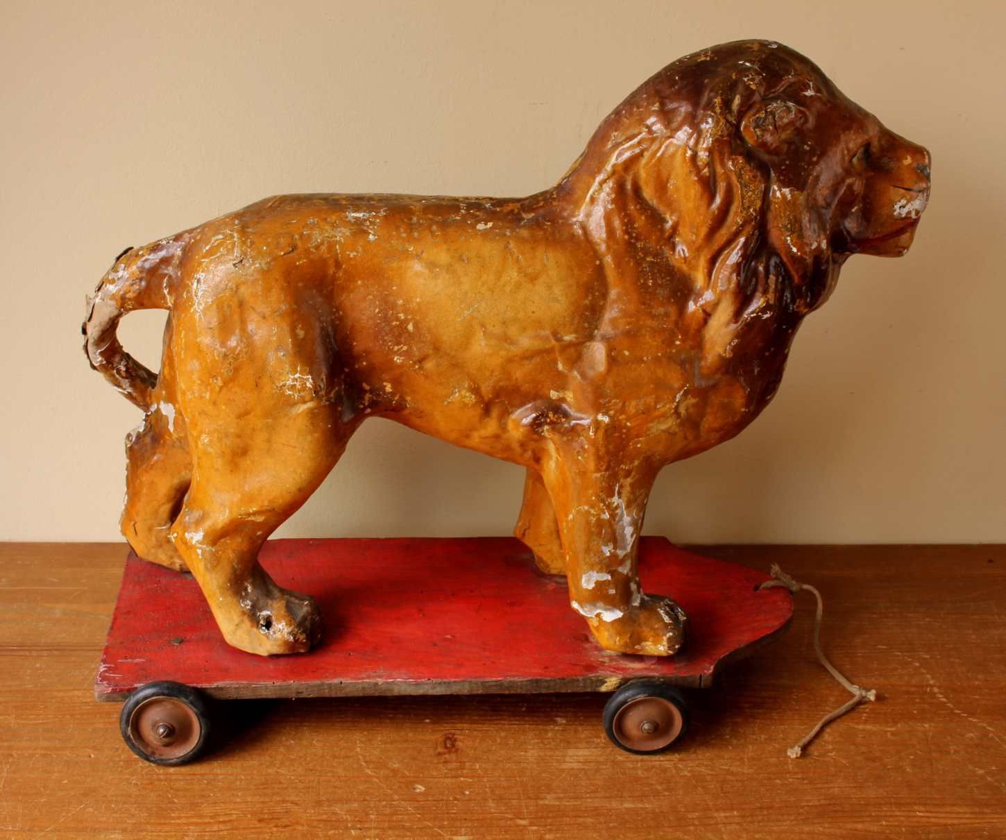 French Pull Along Lion. Paper Mache Model Animal Decorative Toy Trolley. photo Art