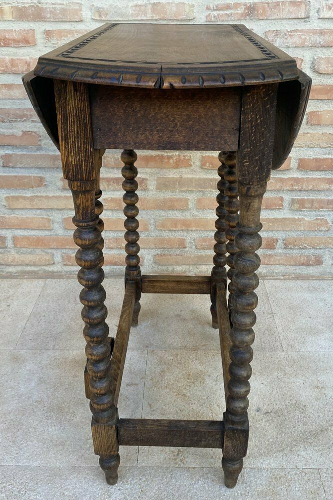 photo buy Round Folding Center Oak Table With Carved Top And Solomonic Legs, 1940s