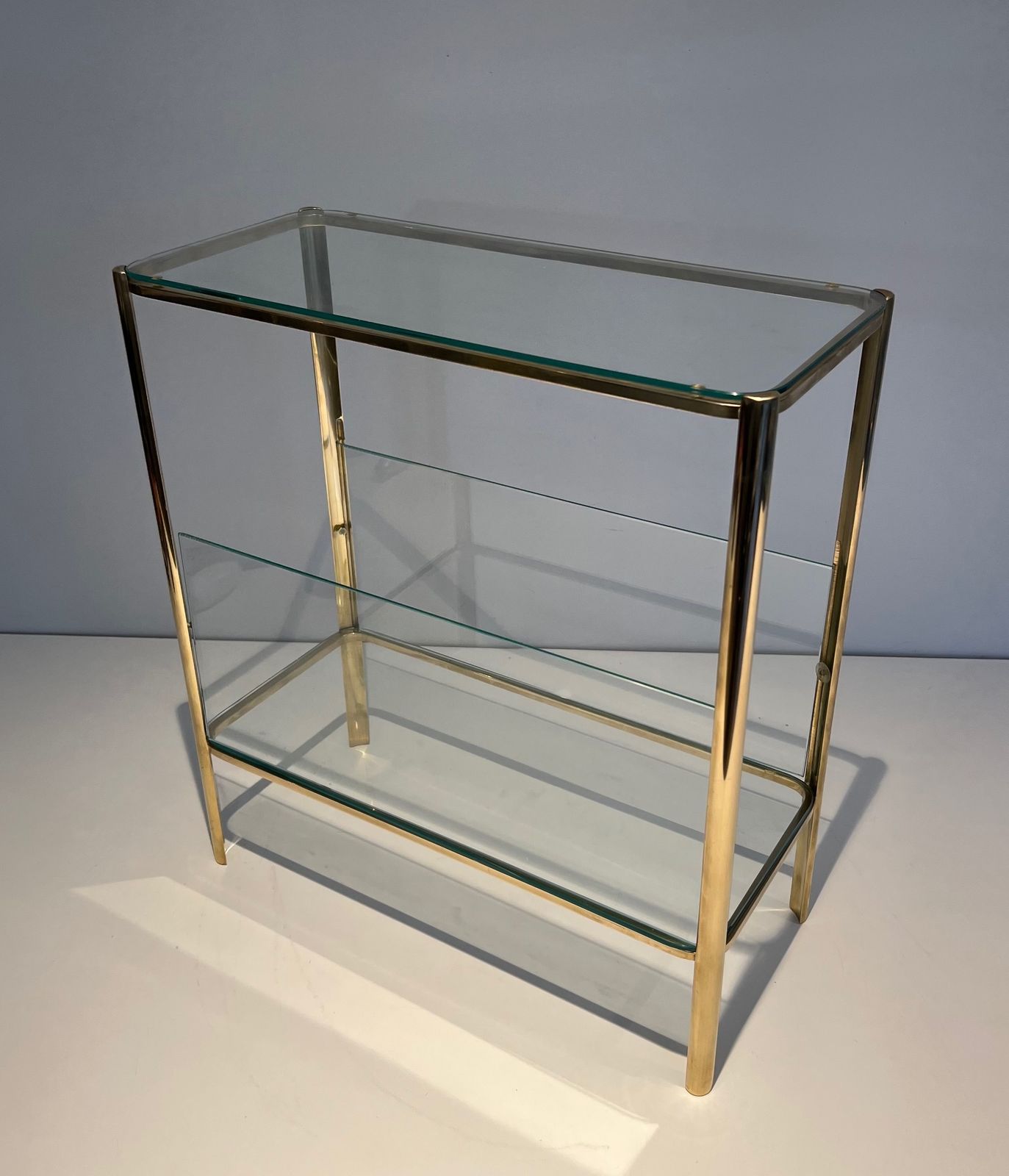 photo for sale Magazine Rack In Polished Bronze And Glass Signed Jacques Théophile Lepelletier And Stamped Broncz