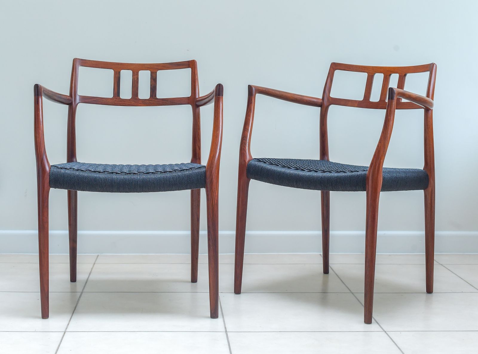 A Scarce Pair Of Niels Møller Model 64 Rosewood Carver Chairs For J L Moller, Denmark. photo furniture