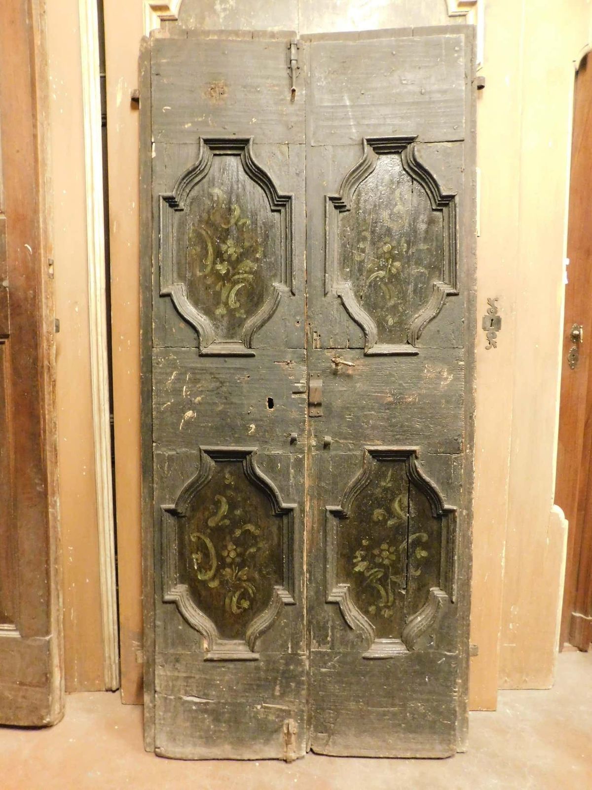 Double Door In Rustic Larch Wood, Black Background And Painted Panels, Italy photo for sale