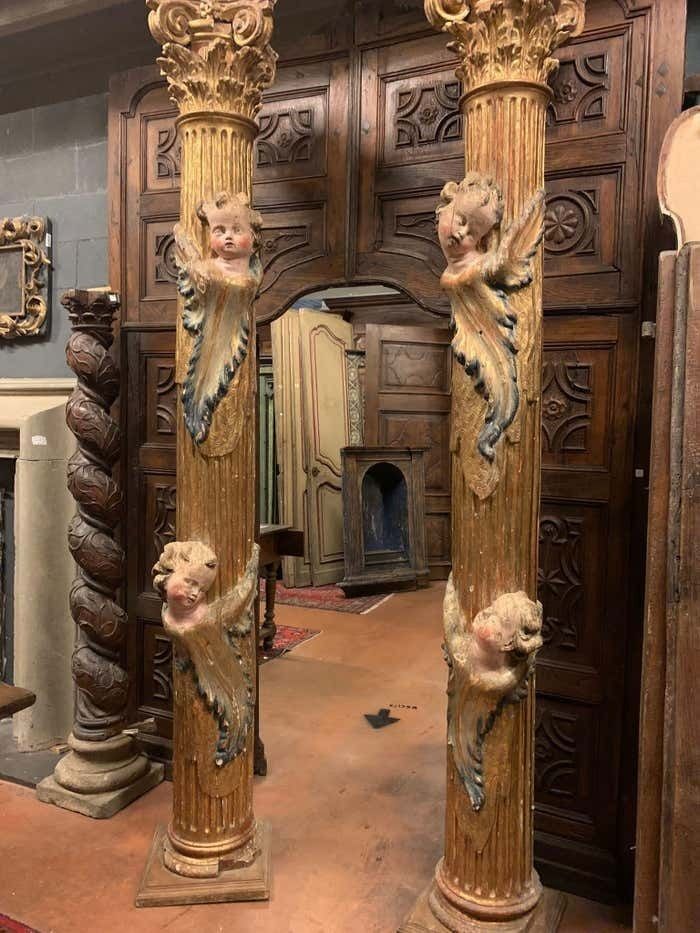 photo for sale Pair Of Wooden Columns, Carved And Gilded With Polychrome Putti, From Spain.