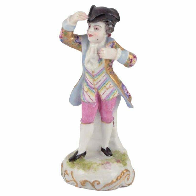 Meissen, Germany. Porcelain Figurine Of Young Man In Elegant Attire.