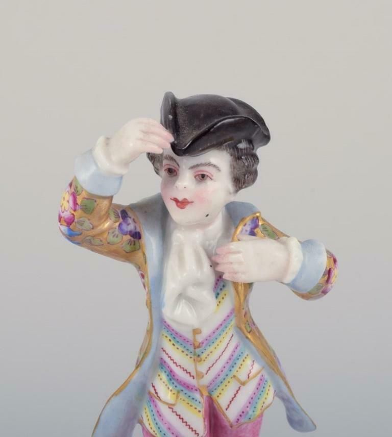 Meissen, Germany. Porcelain Figurine Of Young Man In Elegant Attire. photo vinterior