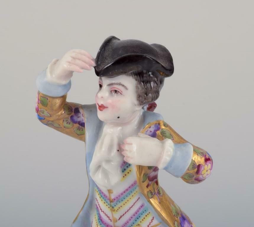 Meissen, Germany. Porcelain Figurine Of Young Man In Elegant Attire. photo buy