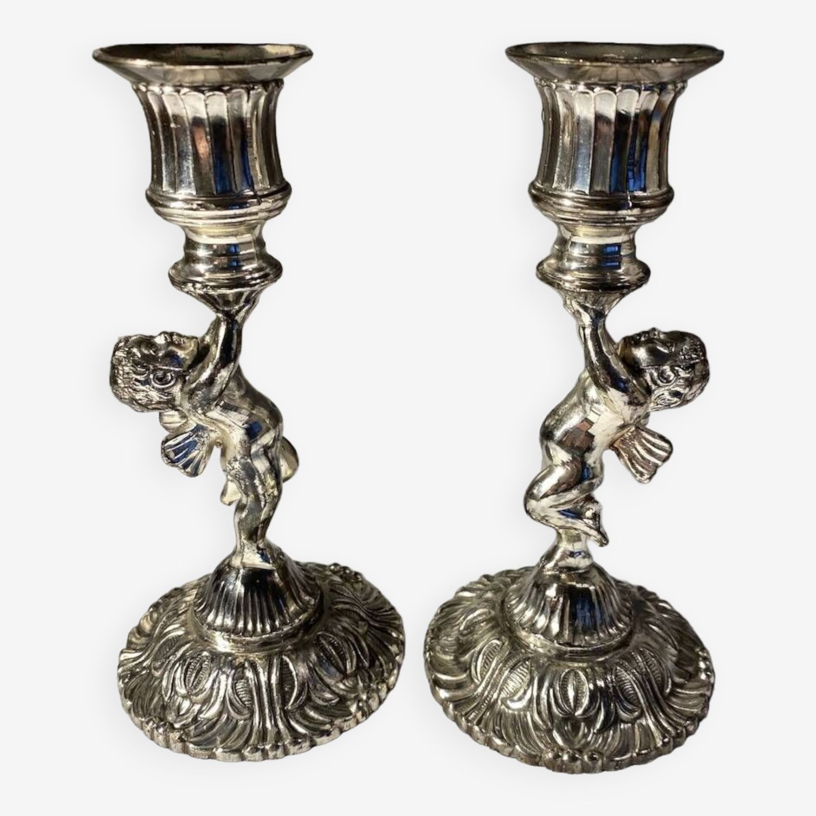 Two Silver Metal Candlesticks Decorated With 20th Century Cherubs