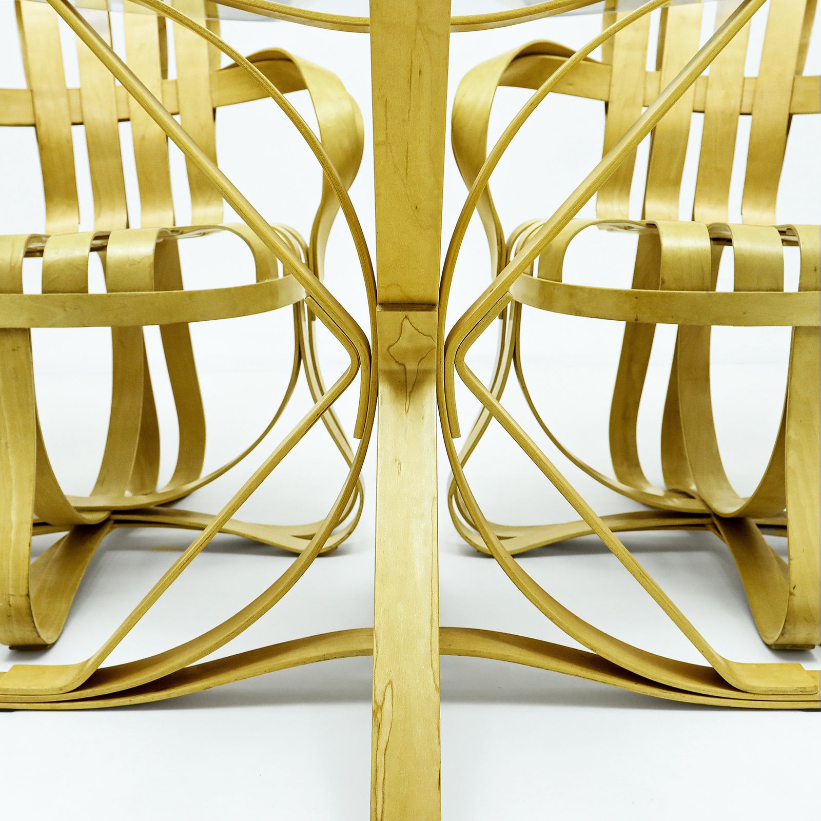 Frank Gehry Dinette Featuring 2 Bentwood Cross Check Chairs Matched To A Face Off Dining Table For Knoll International photo vinterior