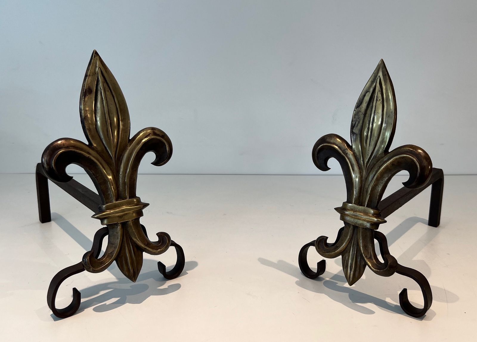 Pair Of Bronze And Wrought Iron Andirons Representing A Fleurs De Lys photo for sale