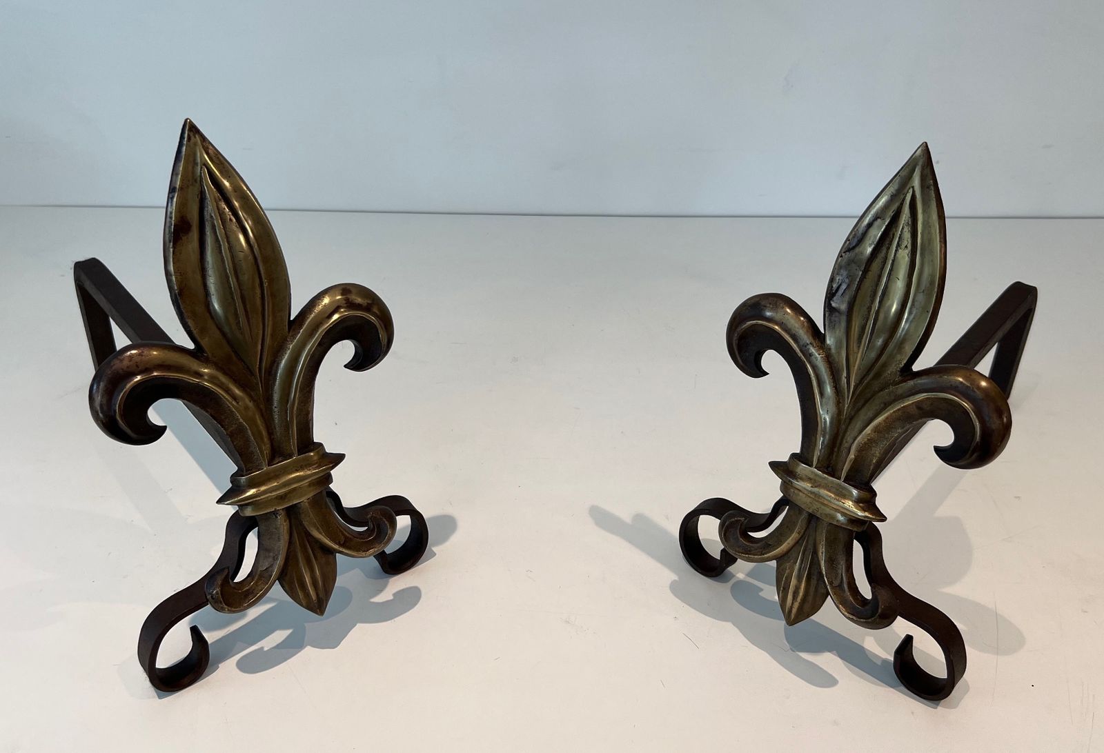 Pair Of Bronze And Wrought Iron Andirons Representing A Fleurs De Lys photo Home Fixtures