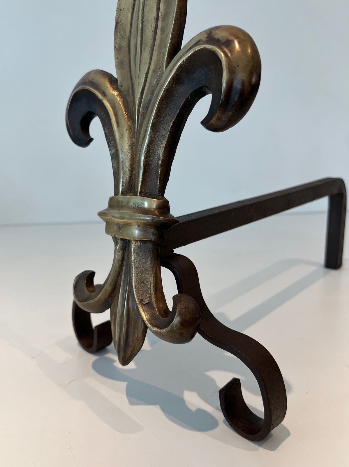 photo for sale Pair Of Bronze And Wrought Iron Andirons Representing A Fleurs De Lys