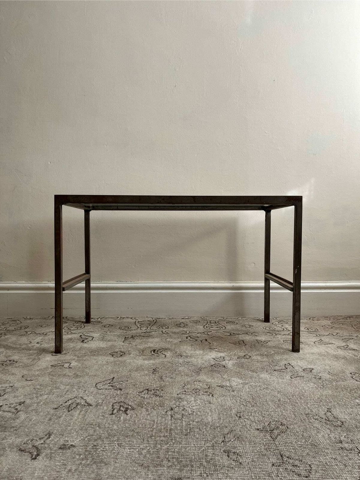 photo furniture Vintage Industrial Steel Frame Coffee Or Side Table With A Minimalist Design And Glass Top