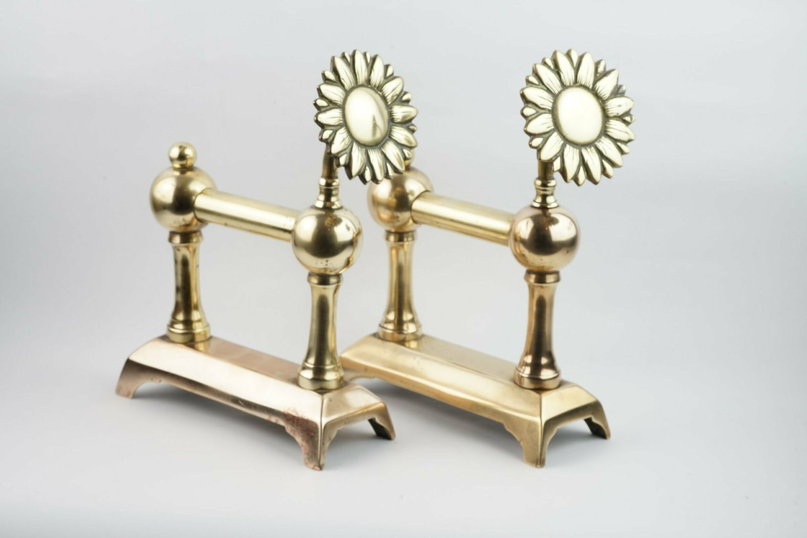 A Pair Of Aesthetic Movement Sunflower Brass Fire Dogs, Circa 1875 photo furniture