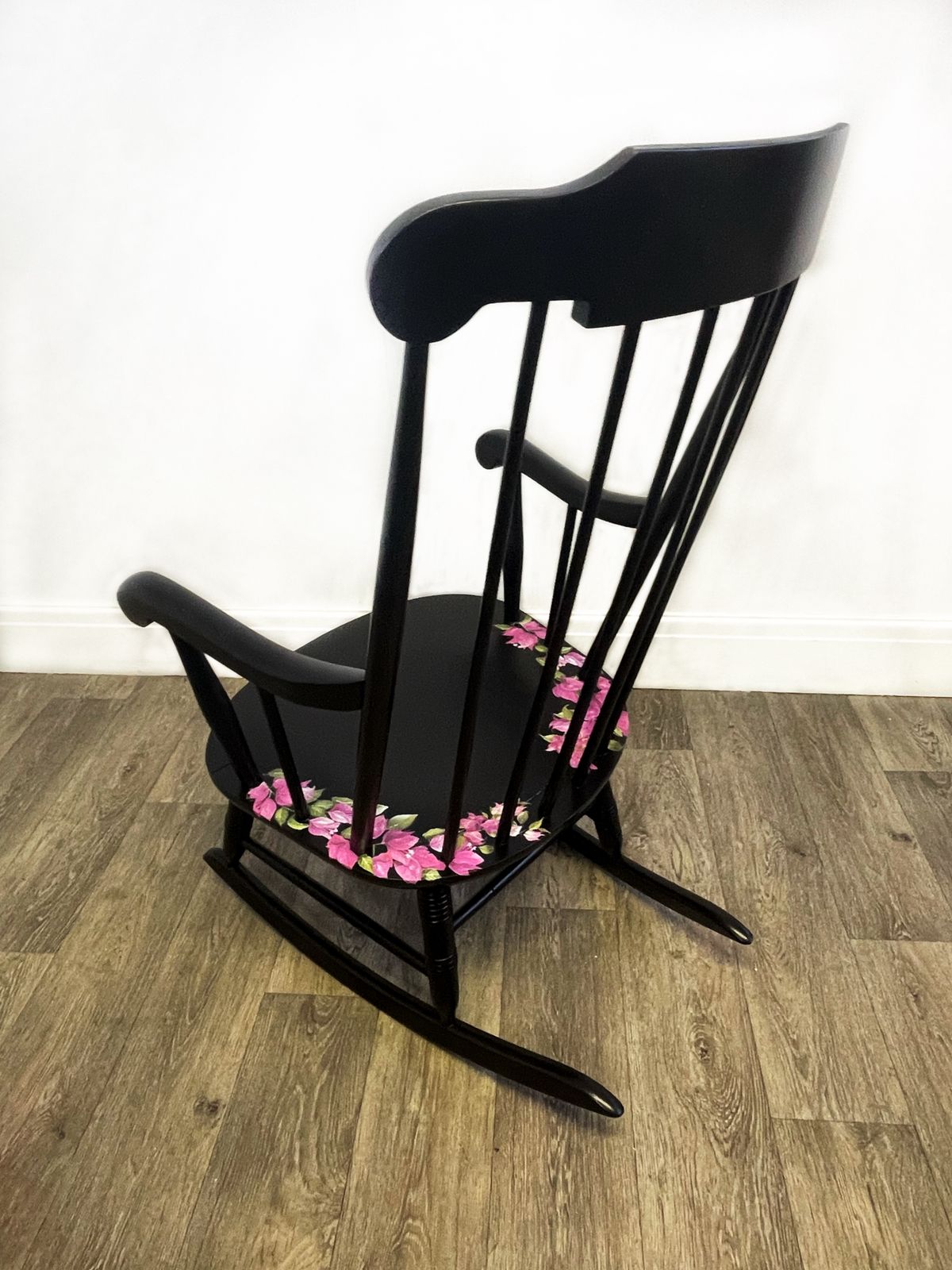 Black Wheel Back Rocking Chair With Pink Flower Design photo 230.0