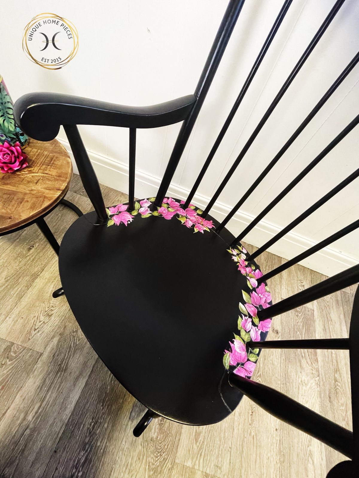 Black Wheel Back Rocking Chair With Pink Flower Design photo vintage