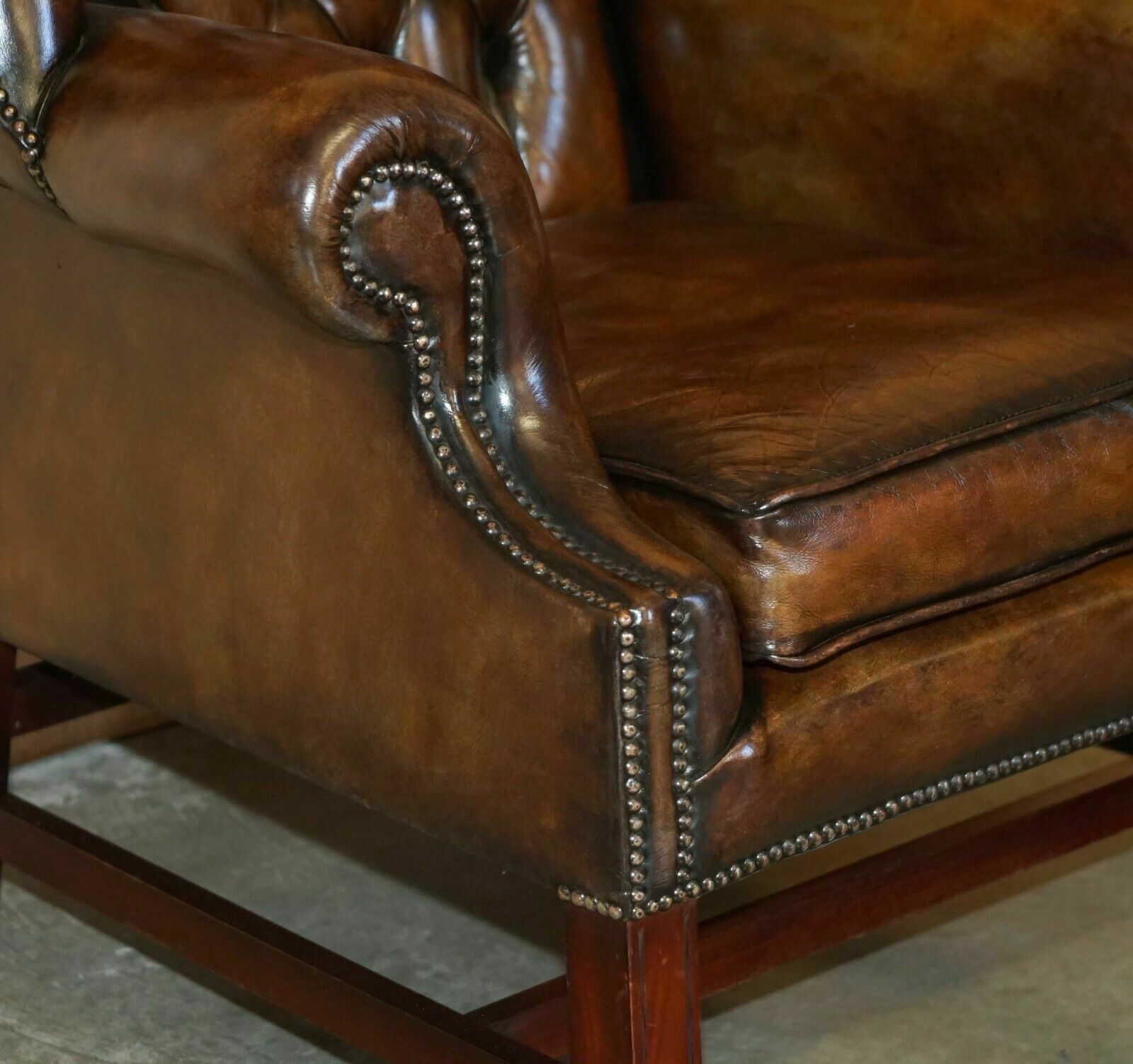 Furniture Comfortable Vintage Restored Brown Leather Tufted Chesterfield Wingback Armchair photo