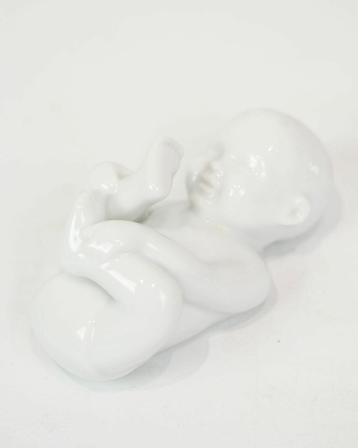 Porcelain Figure Babbling Baby In White Glaze By Allan Therkelsen