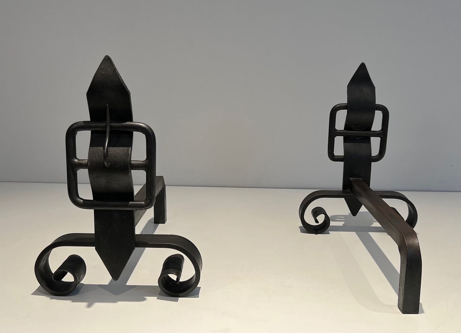 Pair Of Modernist Andirons Representing A Belt photo 1250.0