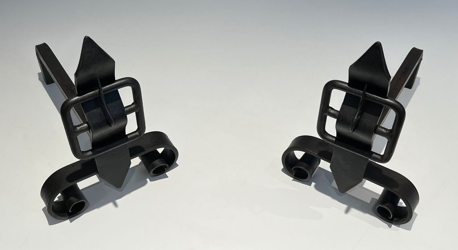 Pair Of Modernist Andirons Representing A Belt photo vinterior