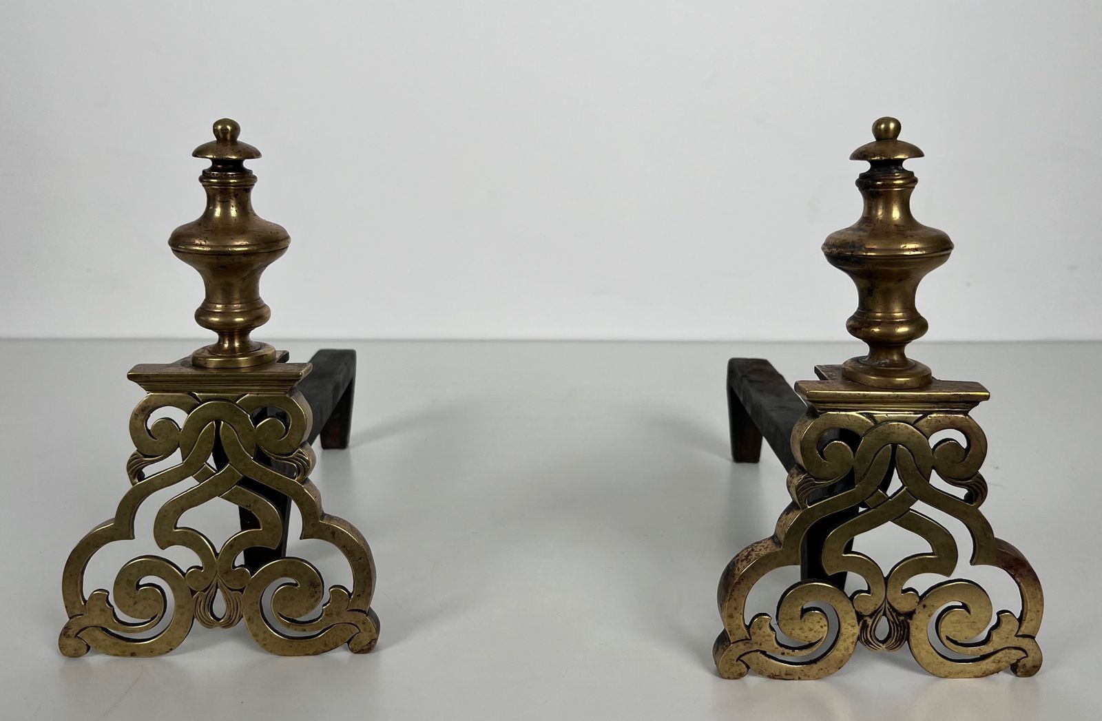 photo buy Pair Of Chiseled Bronze Andirons.