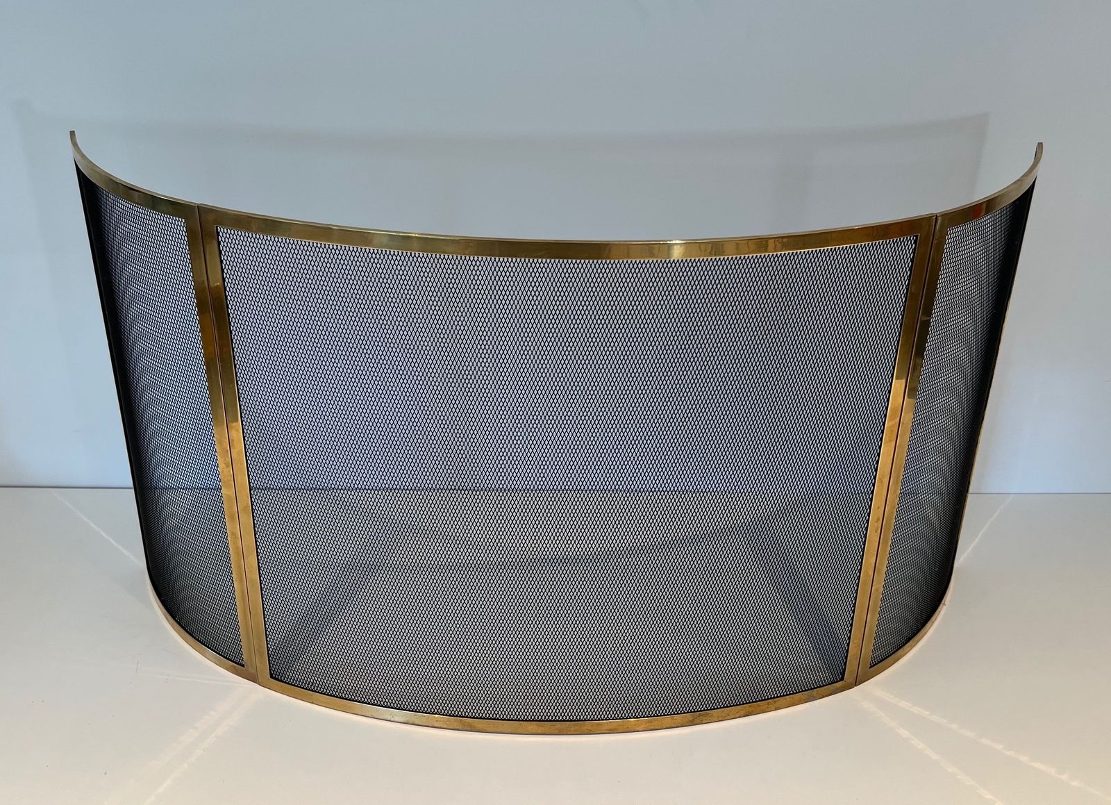 Curved Brass Firewall And Wire Mesh photo furniture