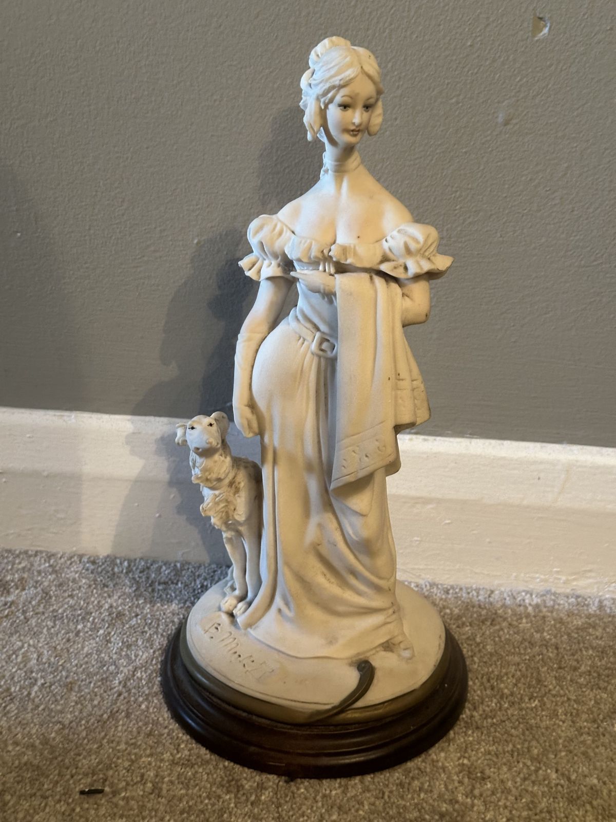 Figurine Made Of Porcelain B. Merli. photo furniture