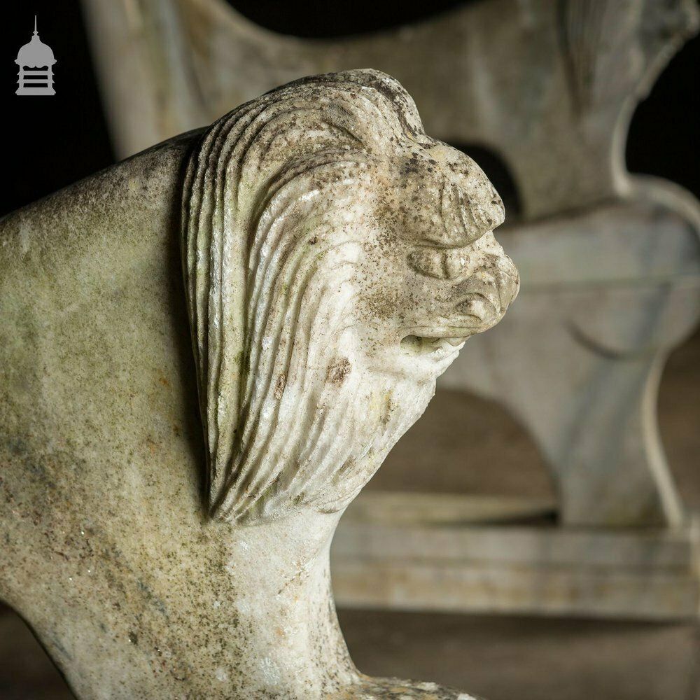 Pair Of Weathered Marble Bench Ends With Carved Dragon Design photo 540.0