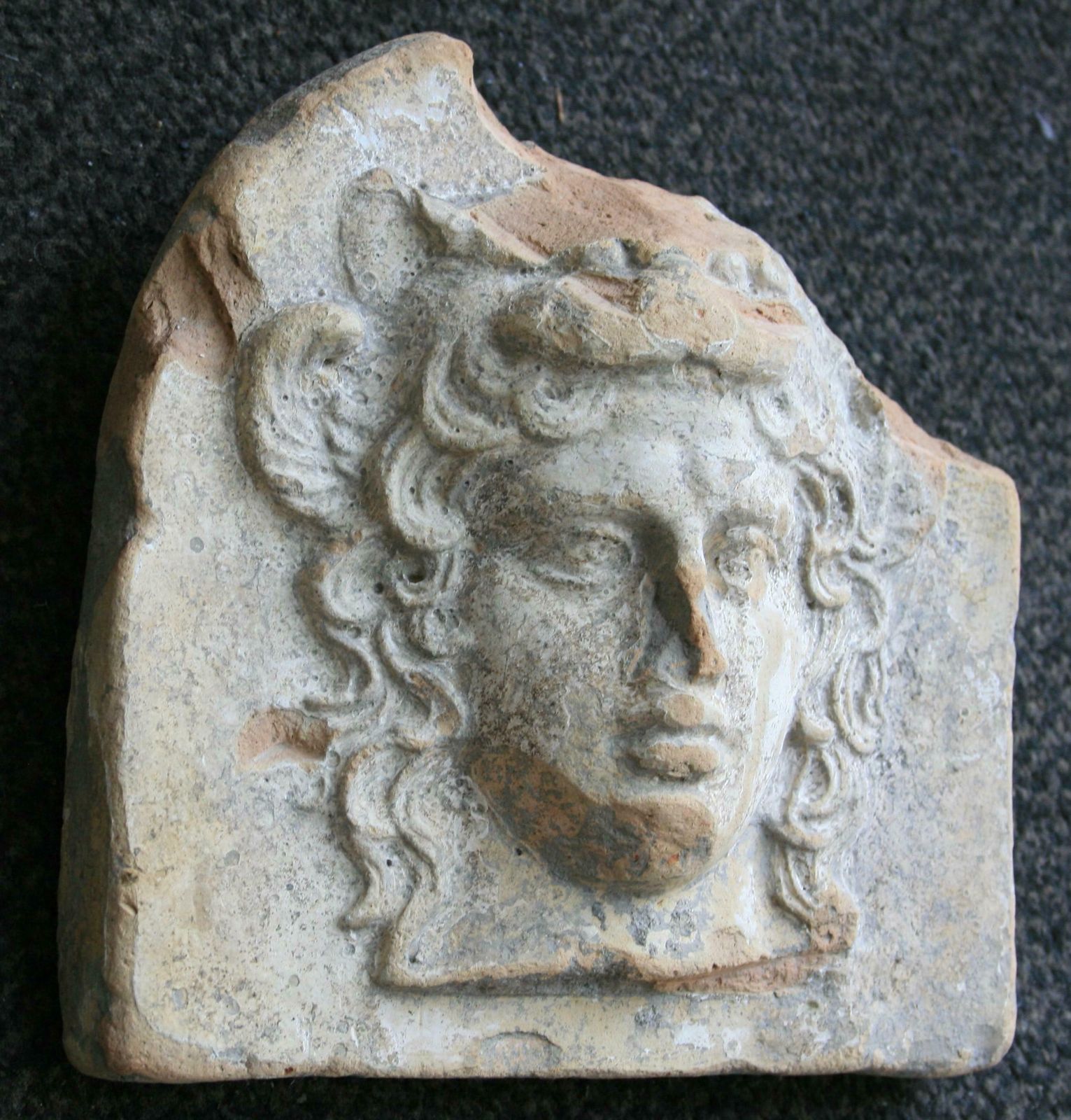 Ancient Greek Terracotta Antefix In Form Of The Head Of Artemis Bendis, Taranto photo vinterior