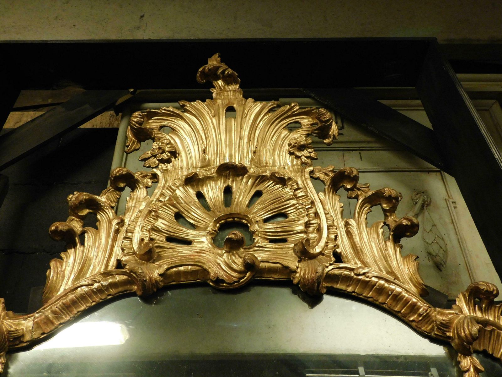 photo for sale Ancient Gilded Wooden Mirror With Richly Carved Cymatium, Italy