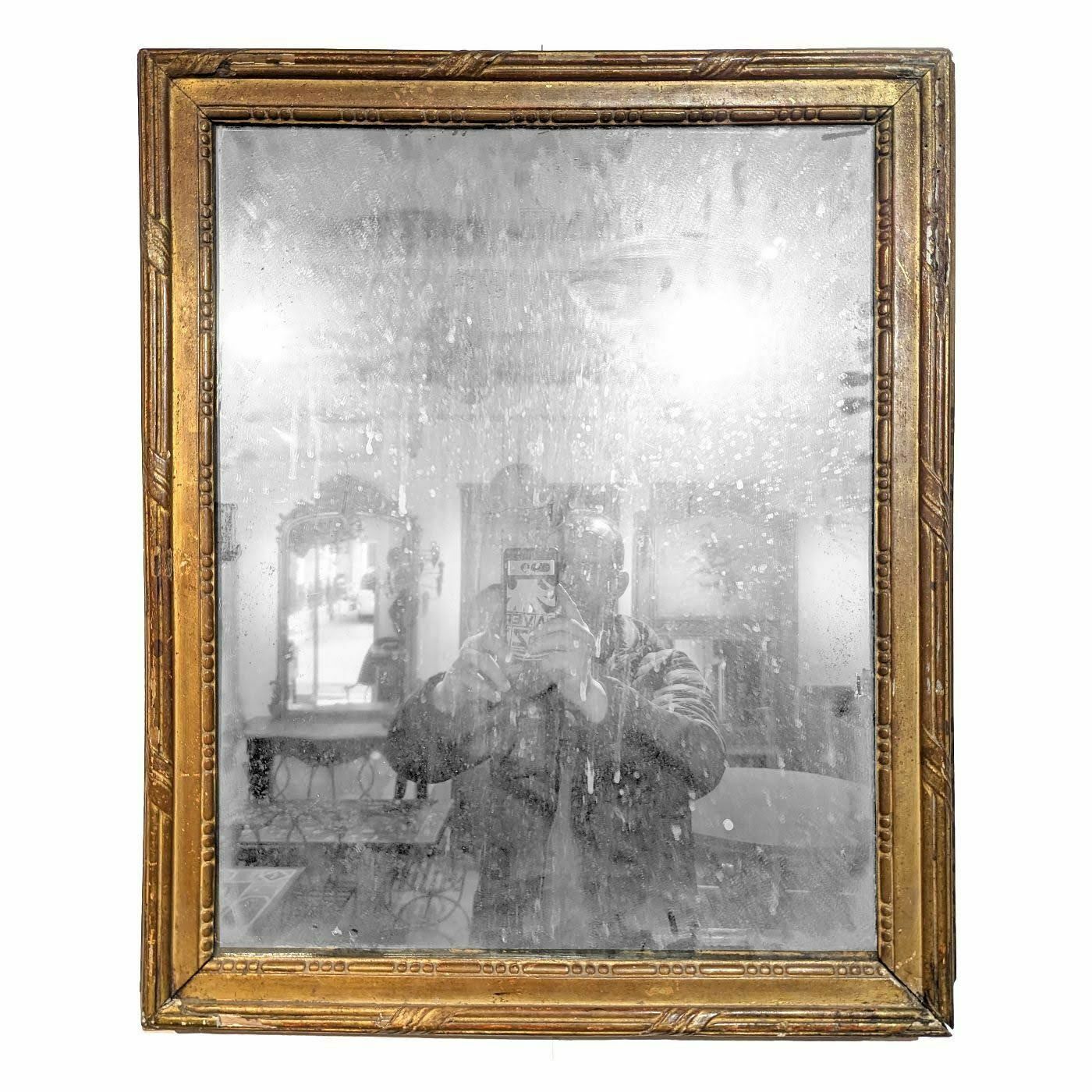 Small Louis XVI Period Mirror In Gilded Wood