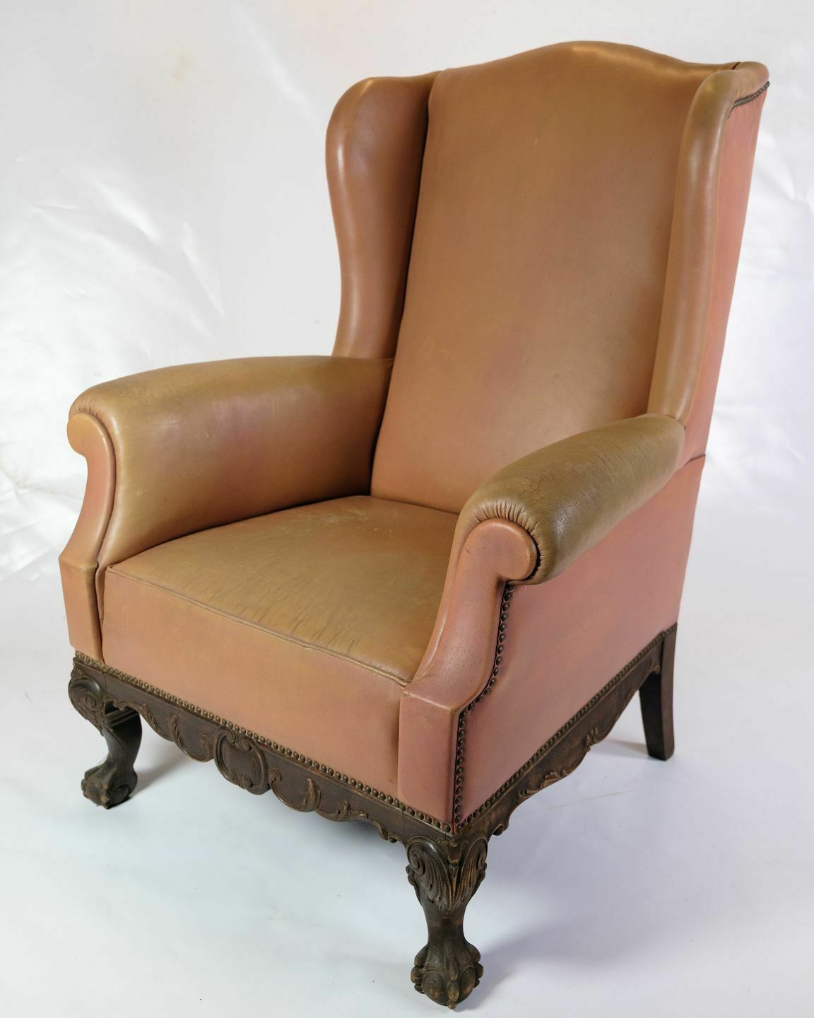 Antique High Ear Flap Chair  In Brown Studded Leather From 1920s