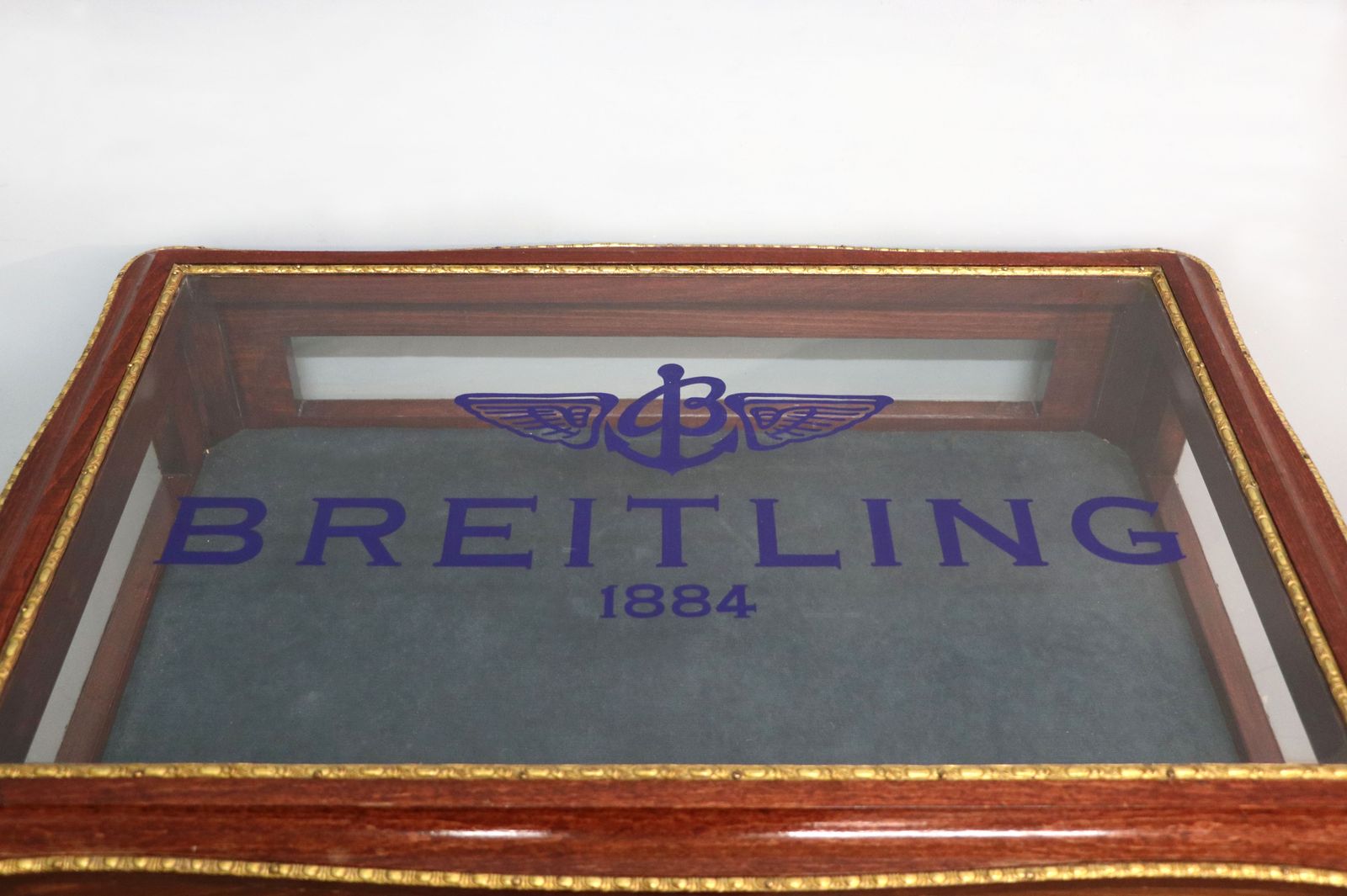 A Lovely 20th Century French Hardwood Bijouterie Display Table Later Sign Written For Breitling Watches. photo Furniture