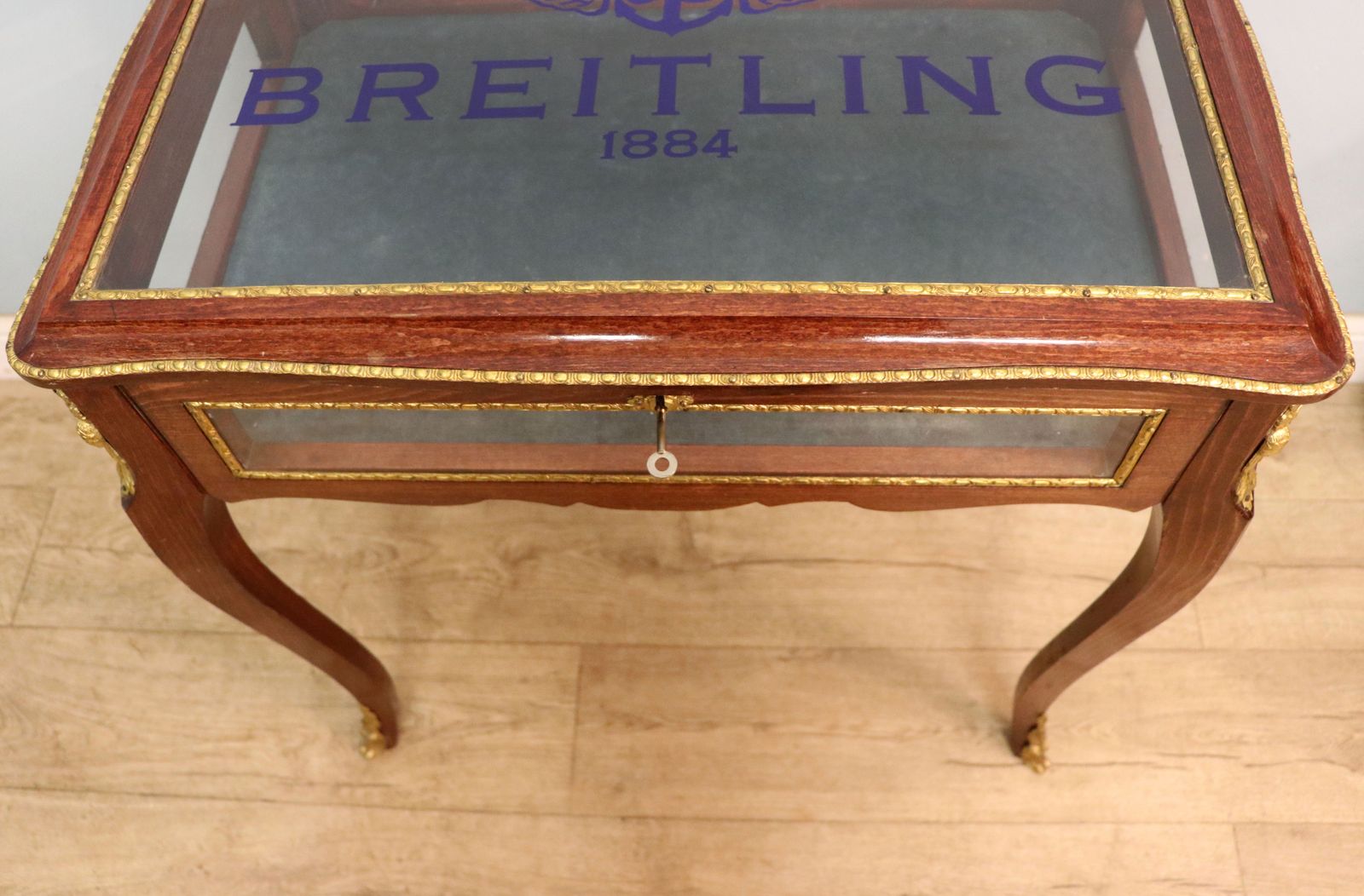 photo for sale A Lovely 20th Century French Hardwood Bijouterie Display Table Later Sign Written For Breitling Watches.