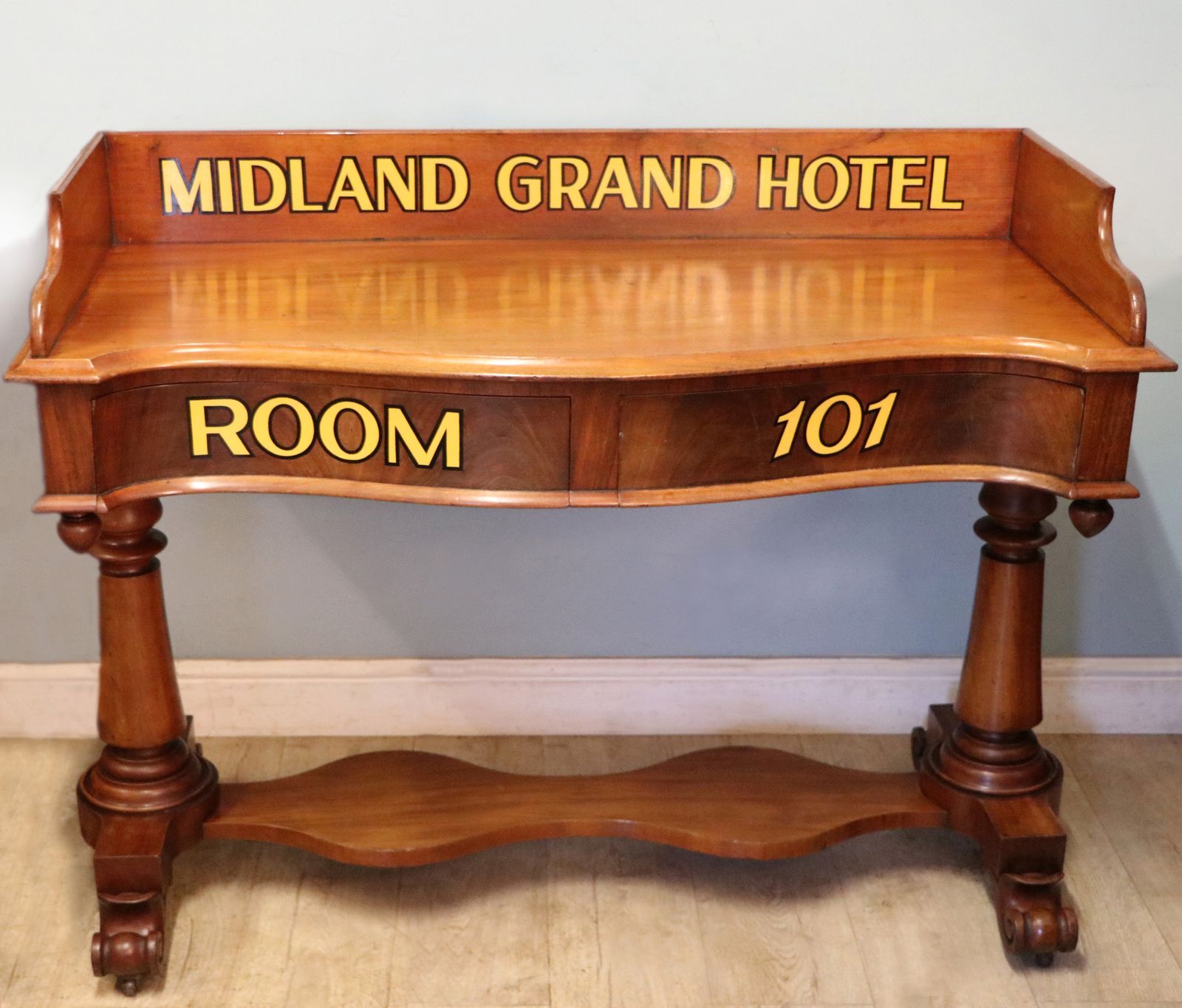 A Lovely Mahogany Side Table Or Washstand Sign Written For The Midland Grand Hotel. photo furniture