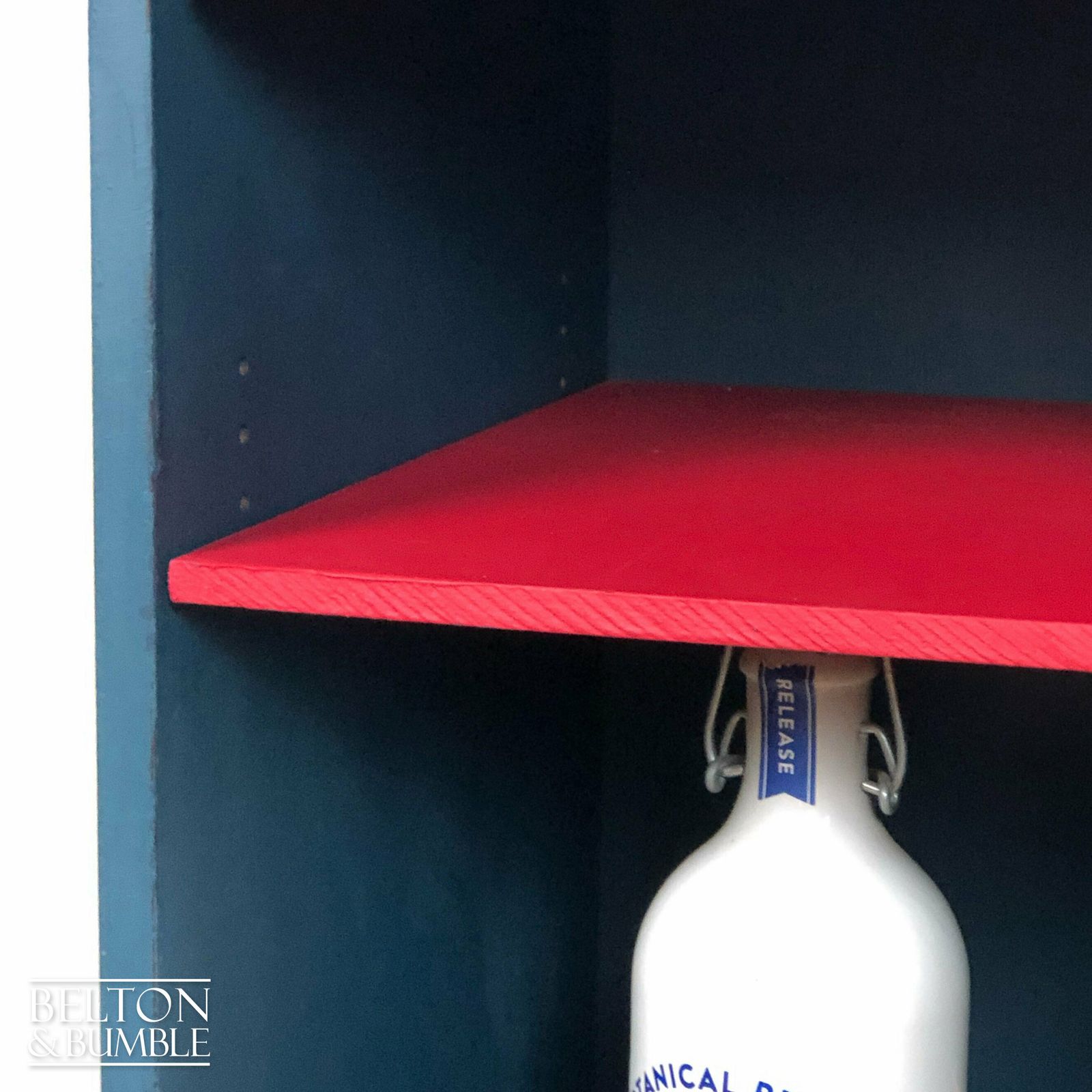 Petite Drinks Cabinet With Glass Door In Blue And Red photo vinterior