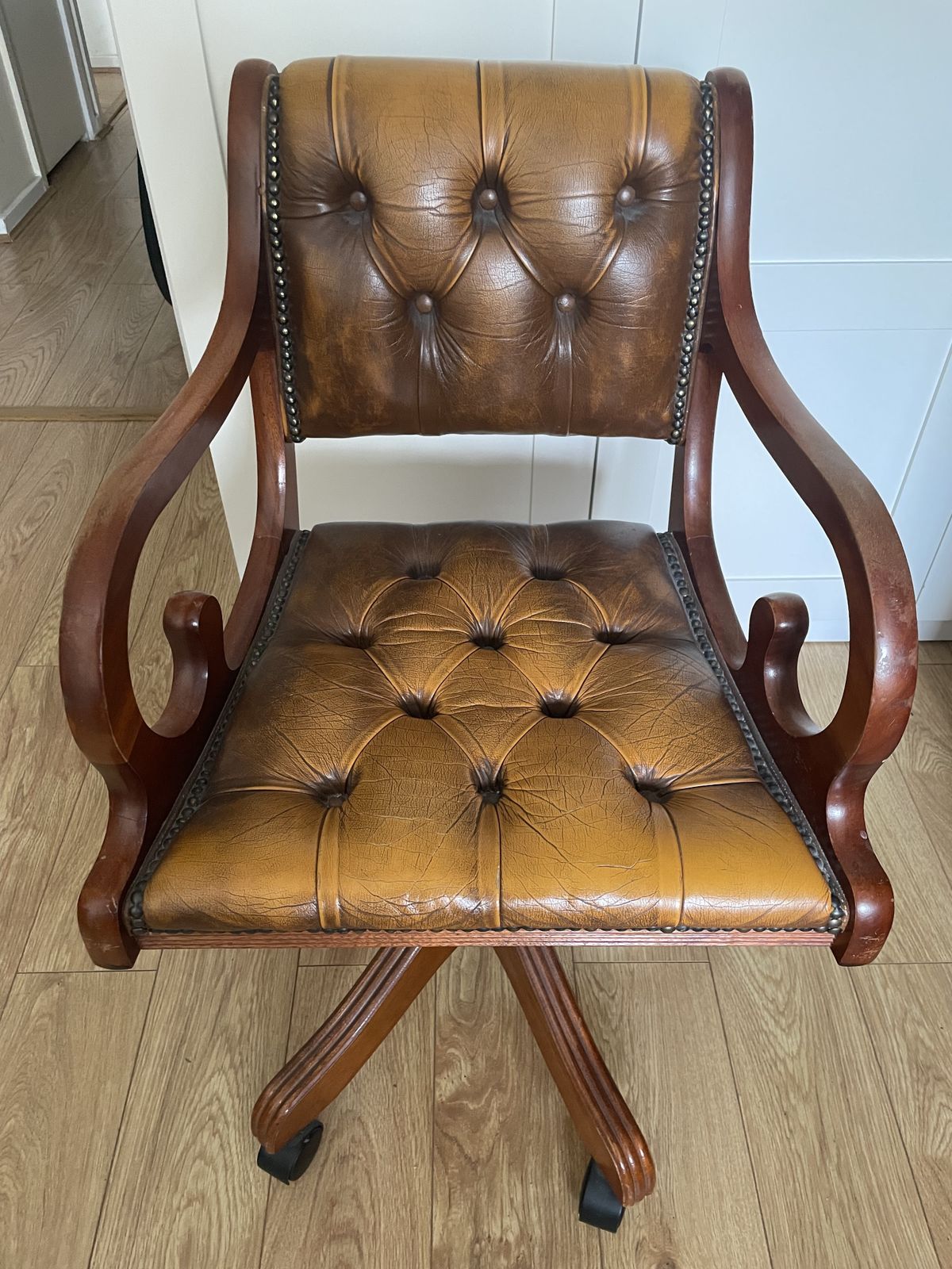 Captain's Wooden Swivel Chair, Embroidered With Leather Upholstery.