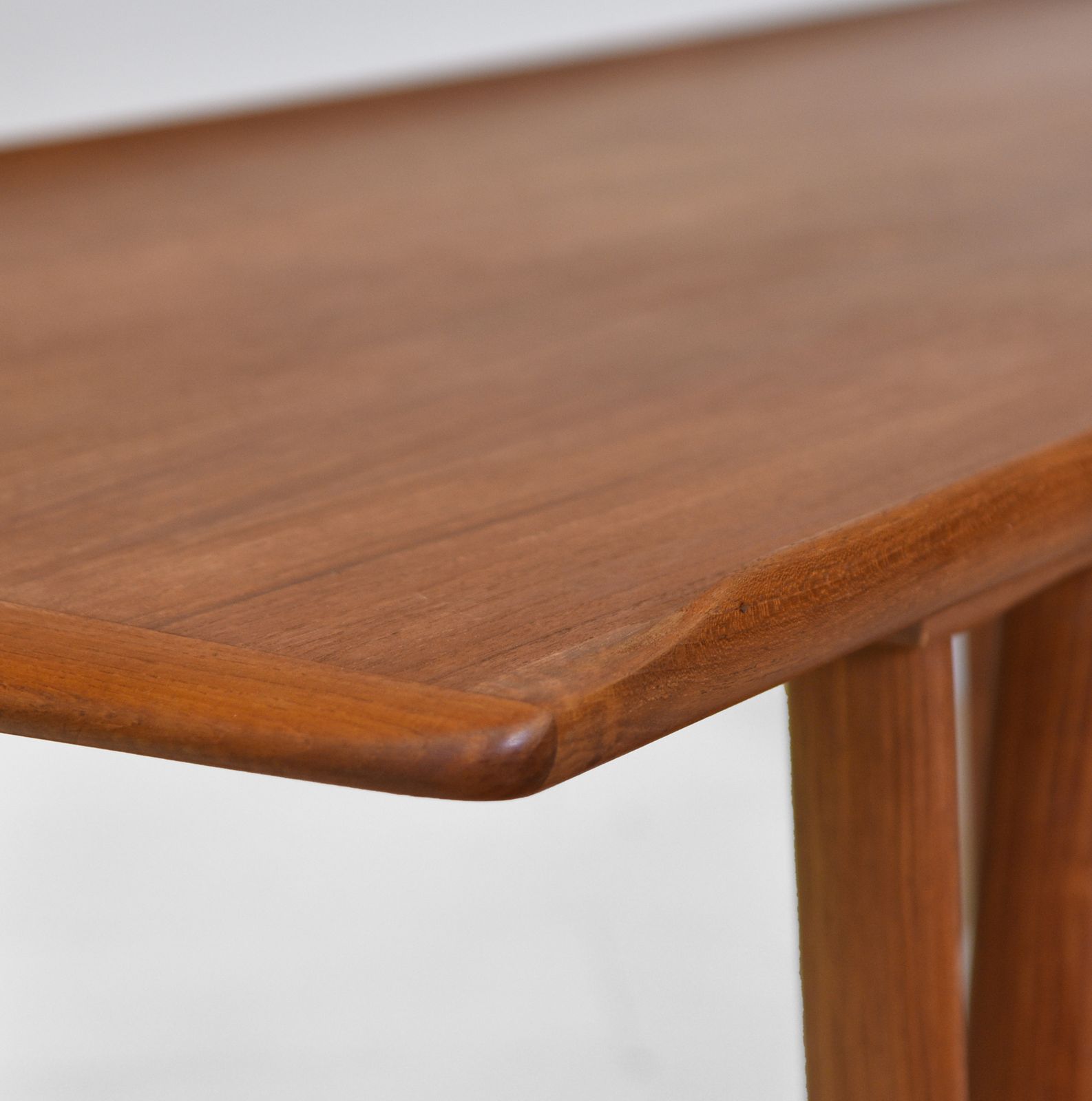 Mid Century Danish Teak Coffee Table On V Shape Supports And Lipped Top Edge photo buy