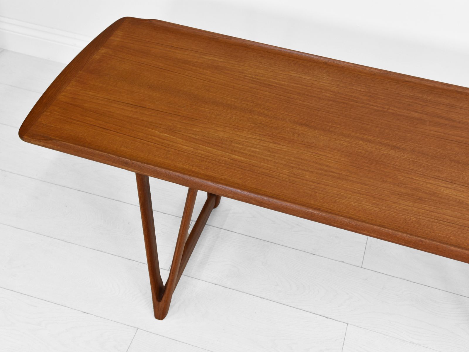 Mid Century Danish Teak Coffee Table On V Shape Supports And Lipped Top Edge photo vintage