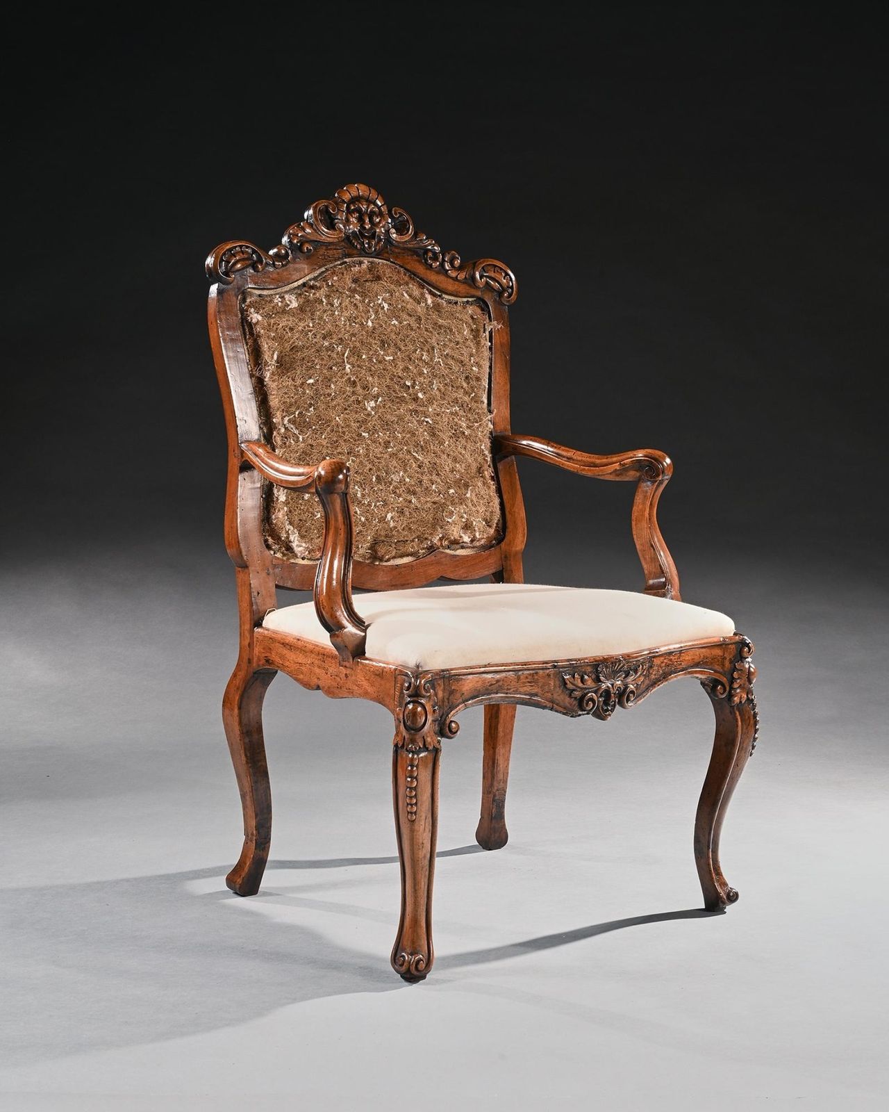 Mid 18th Century Italian Rococo Armchair In Walnut With Extravagantly Carved Head Rail photo for sale