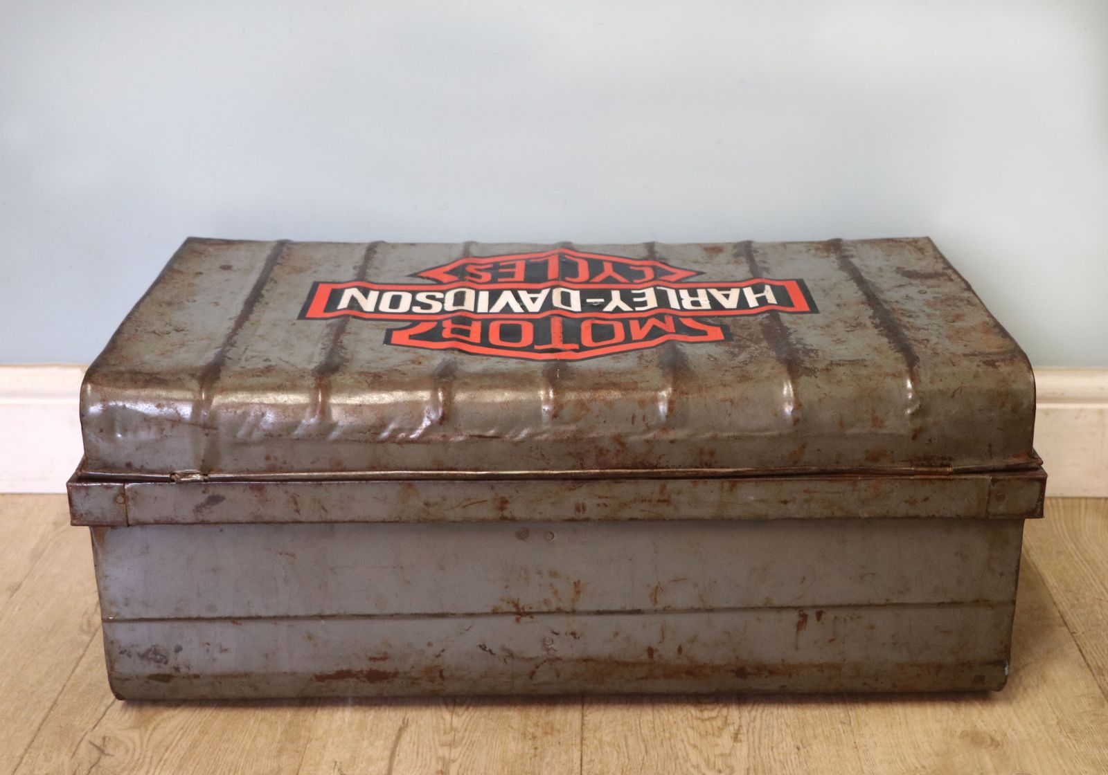 A Lovely Vintage Metal Trunk Which Has Been Later Hand Sign Written With The Harley Davidson Emblem. photo for sale