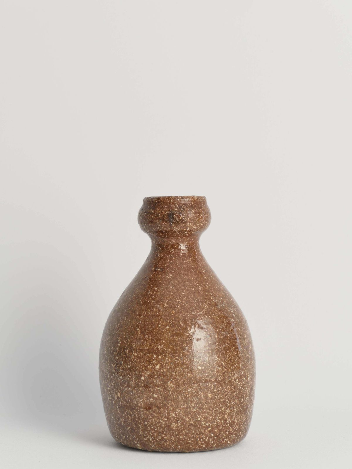 Japanese Shigaraki Inspired Handmade Stoneware Vase With Barnacle Like Texture photo vinterior